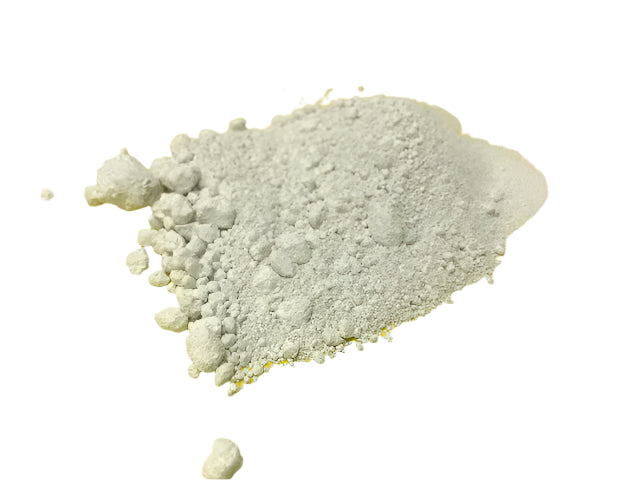 Close-up of a pile of white stannic oxide to show how fine the powder is