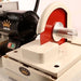 close up of red diamond sintered saw blade on cabber machine trim saw attachment