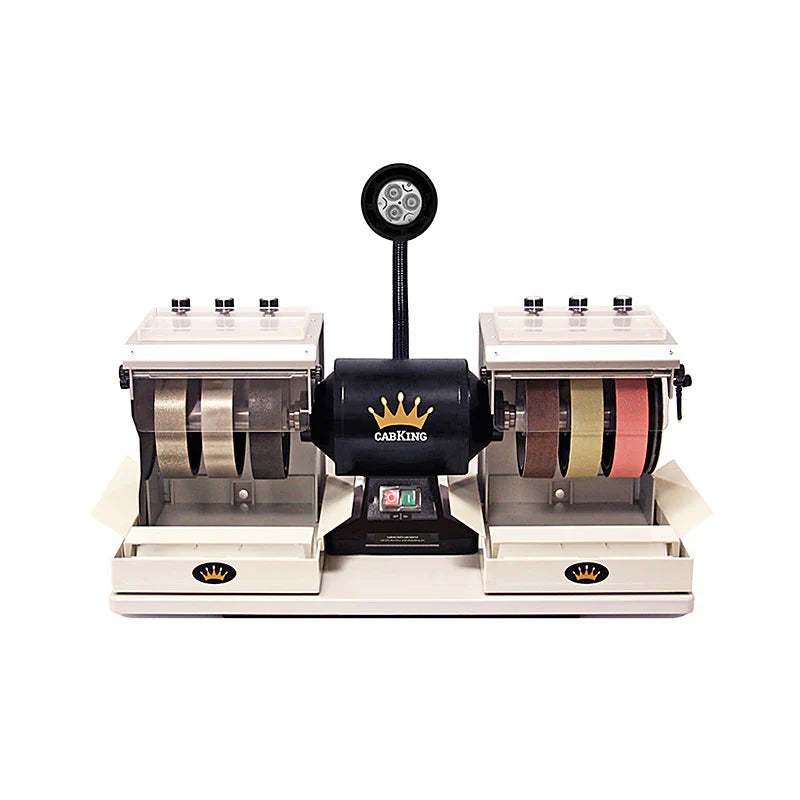 front view of rock cabbing machine shoing all 6 grinding and polishing wheels or creating cabochons and jewelry on a white backgroun