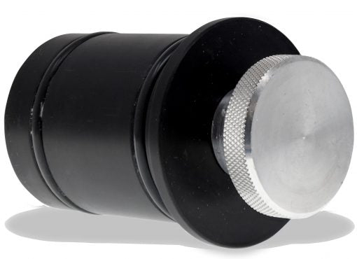 close up of discharge plug for burr king vibra king bowl with rubber stopper and metal screw on top