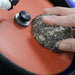 closeup of hand holding an agate rock to the hi tech diamond 8 slant cabber
